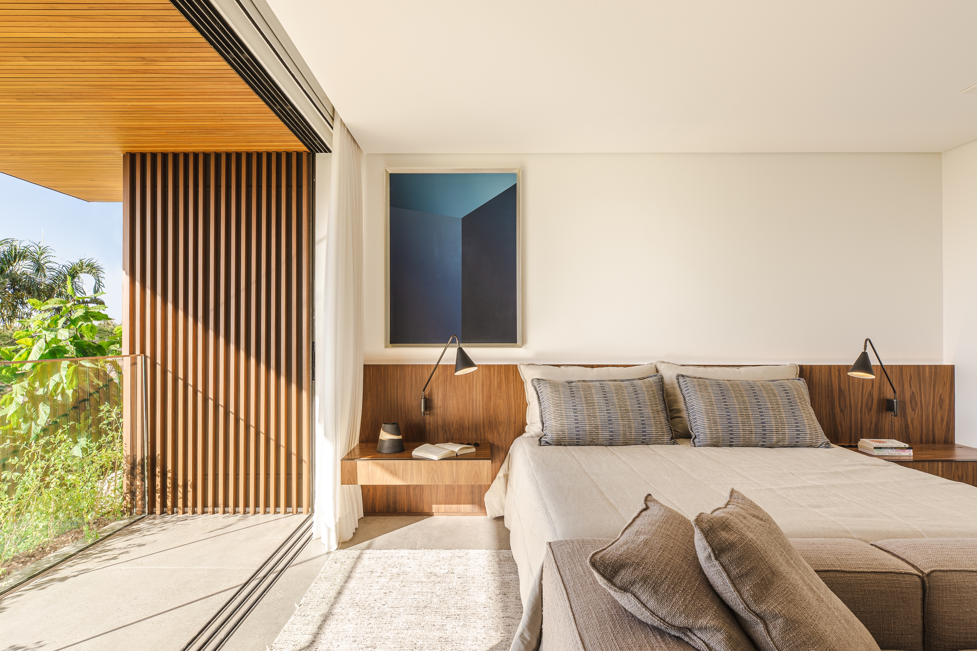 One of the rear bedrooms with a terrace overlooking the garden