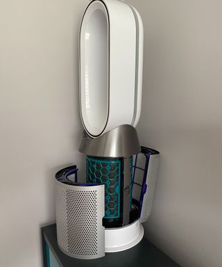 A Dyson fan with its side panels off