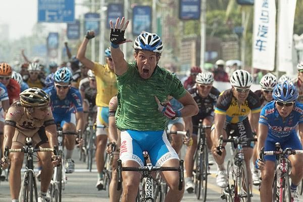 That's five for me: Kenny Van Hummel (Skil-Shimano) indicates his feat of five stage wins as Tour winner, Valentin Iglinskiy of Astana (partly obscured) begins his celebrations in Sanya.