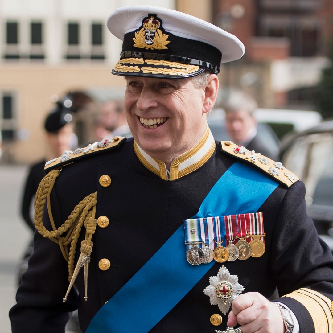 Prince Andrew wearing a military uniform and smiling