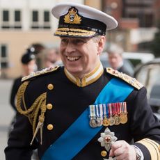 Prince Andrew wearing a military uniform and smiling