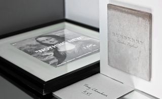 Fashion week invitations showing three items on display. Left: A Mona Lisa image with "Nothing new' overlay. Right: A Burberry, London, England print. Below. A Tony Chambers hand written note.