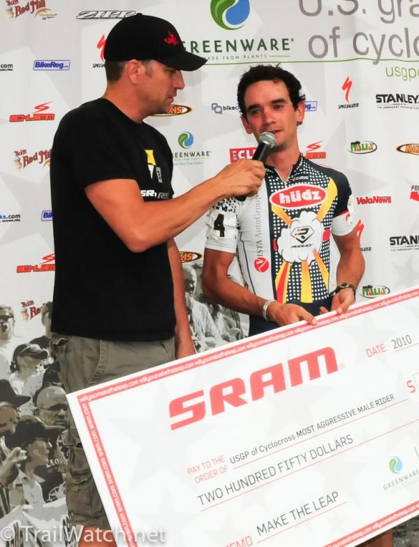 Davide Frattini (Hudz-Subaru) is presented a check for winning the "most aggressive rider" award.