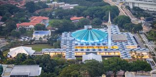 The blue star-shaped roof and minaret of the National Mosque of Malaysia in Kuala Lumpur