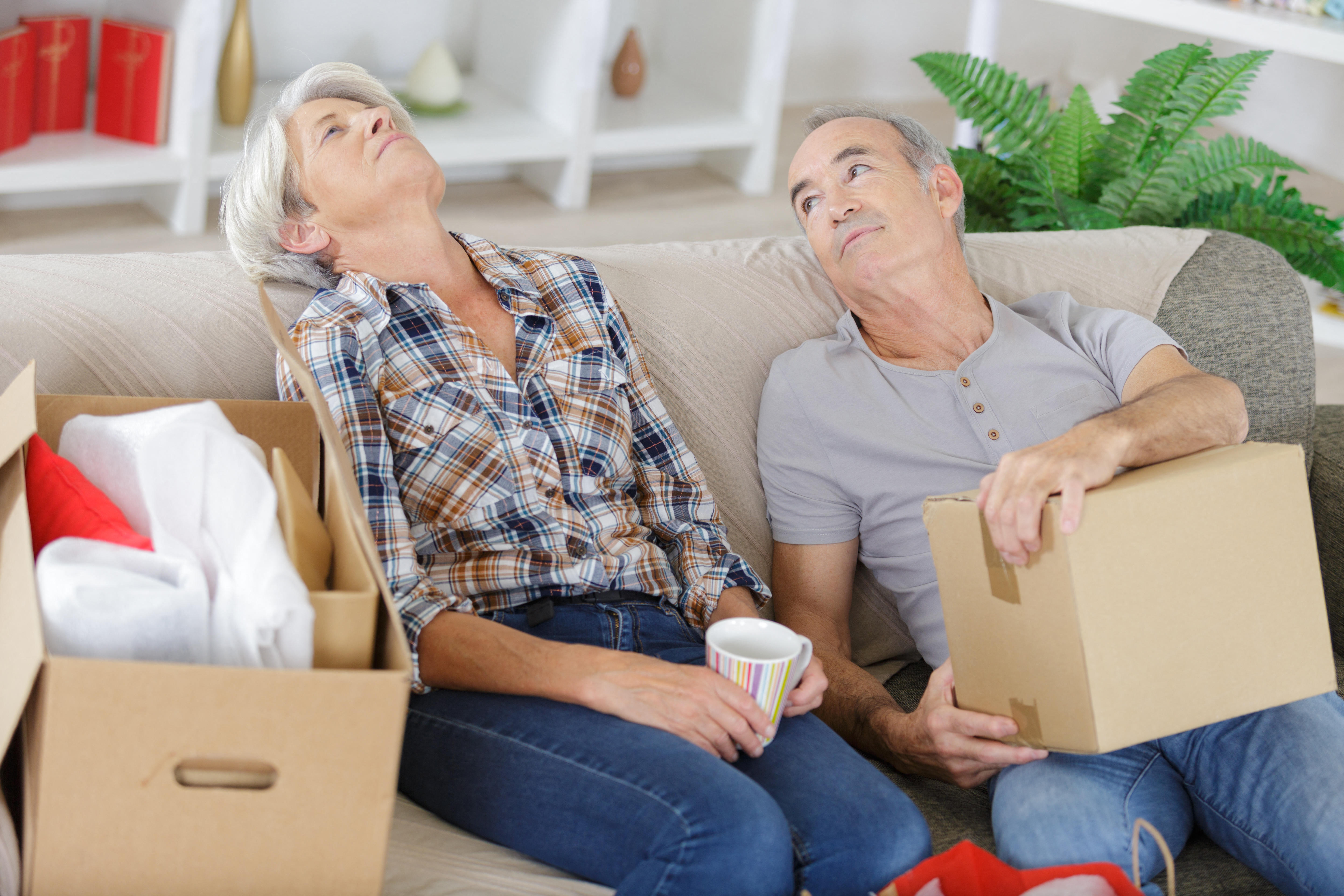 2A0DKK0 tired mature couple moving houses