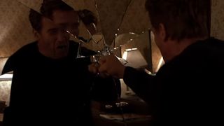 Arnold Schwarzenegger punches a mirror in End of Days