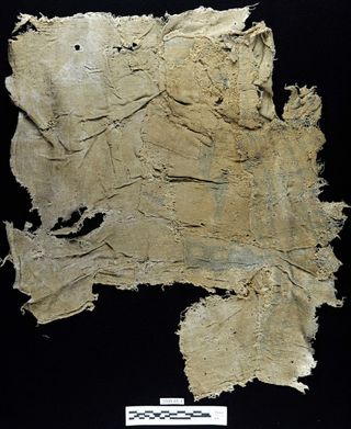 This ancient scrap of fabric, decorated with indigo blue stripes, was found embedded in a concrete-like material that made up Peru's Huaca Prieta temple.