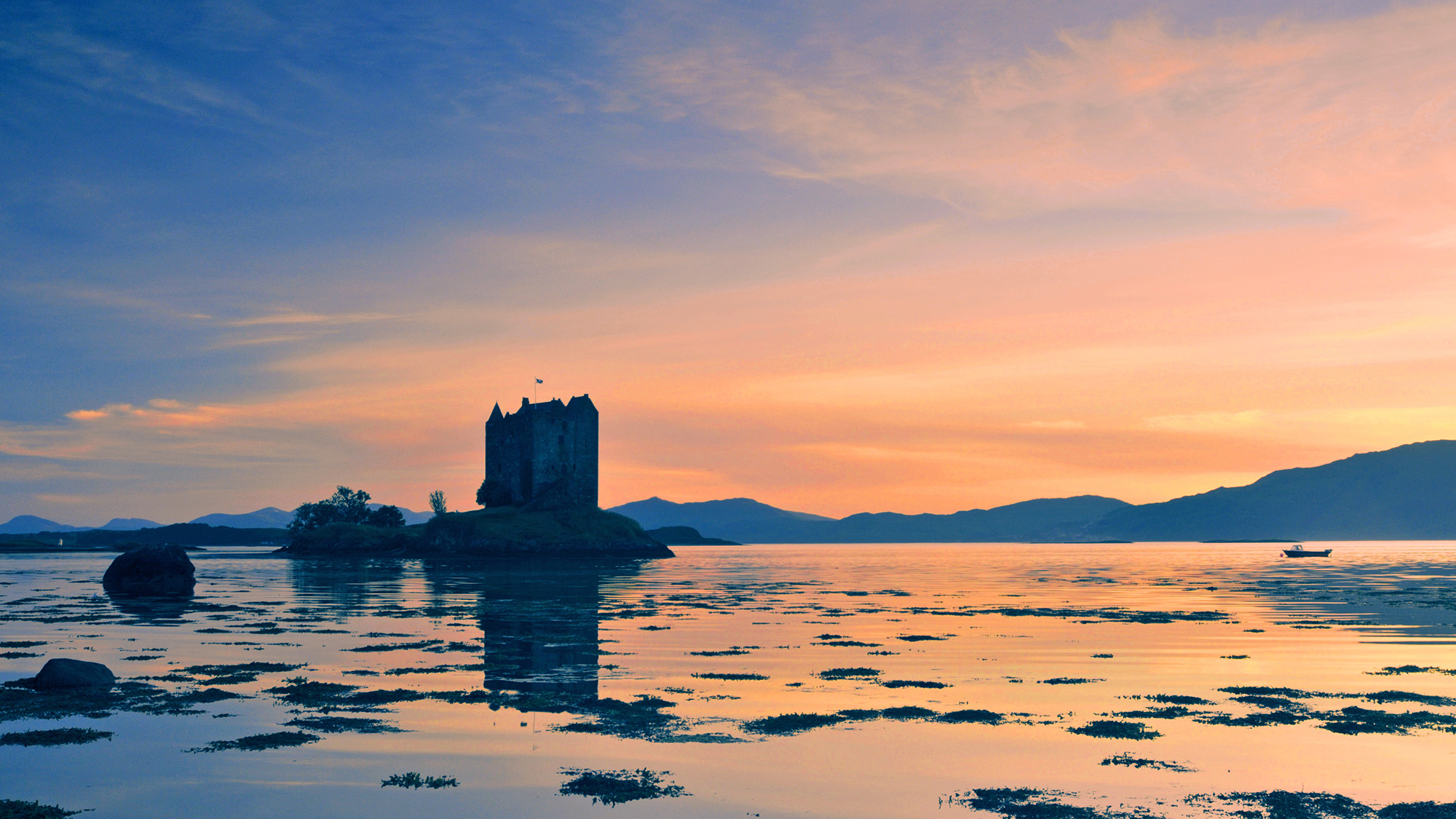 Castle on a loch at sunset