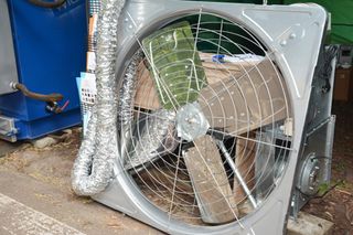 A close-up of an attic ventilator, roof ventilator fan in a steel construction for house ventilation