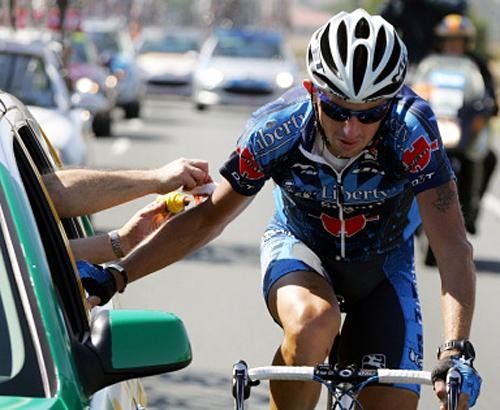 Dariusz Baranowski (Liberty Seguros) receives medical attention after getting back on his bike.