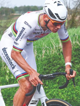 A man cycling with a smart watch on