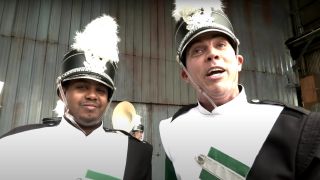 Jasper Dolphin and Steve O standing around in marching band uniforms in Jackass Forever.