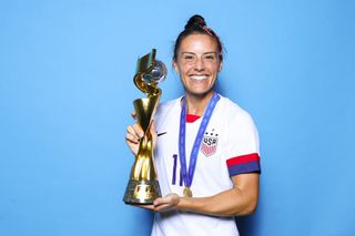 Ali Krieger with a trophy