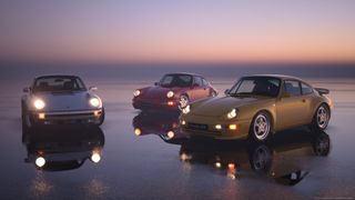 Gran Turismo 7 review screenshot showing three Porche cars against a beautiful backdrop