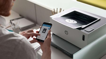 Person using an HP printer and app