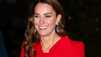 Catherine, Duchess of Cambridge (wearing Queen Elizabeth, The Queen Mother's Sapphire and Diamond Fringe Earrings) attends the 'Together at Christmas' community carol service at Westminster Abbey on December 8, 2021 in London, England. The carol service, hosted and spearheaded by The Duchess of Cambridge, pays tribute to the work of individuals and organisations across the UK who have supported their communities through the COVID-19 pandemic. 