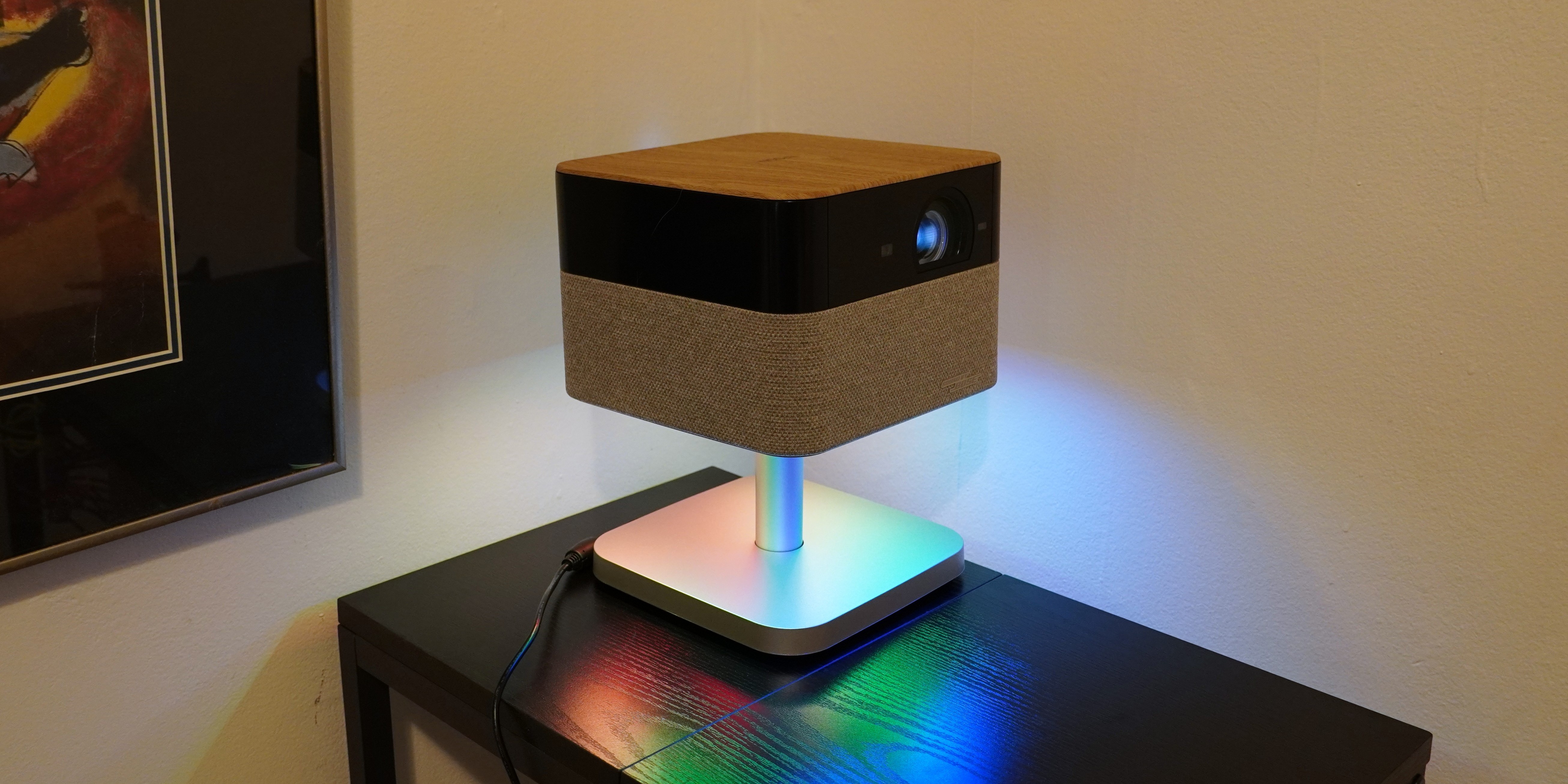 Epson Lifestudio Flex Plus projector on table with colored lights