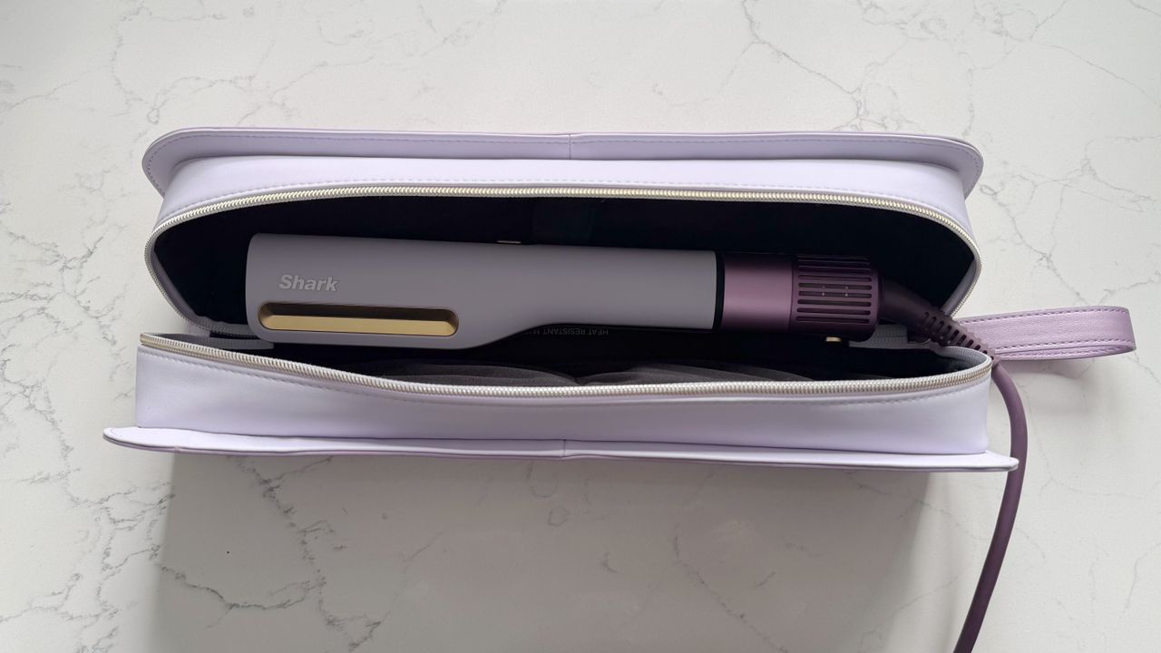 Shark SilkiPro Straight sitting inside its open heat-resistant storage case, showing the styler and vented base