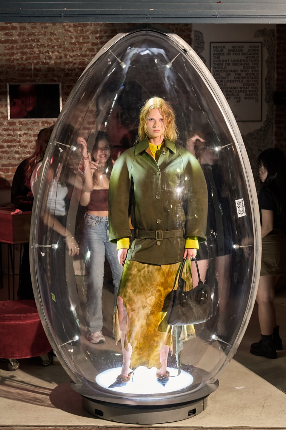 Diesel Spring/Summer 26 egg hunt - model wears khaki jacket yellow skirt