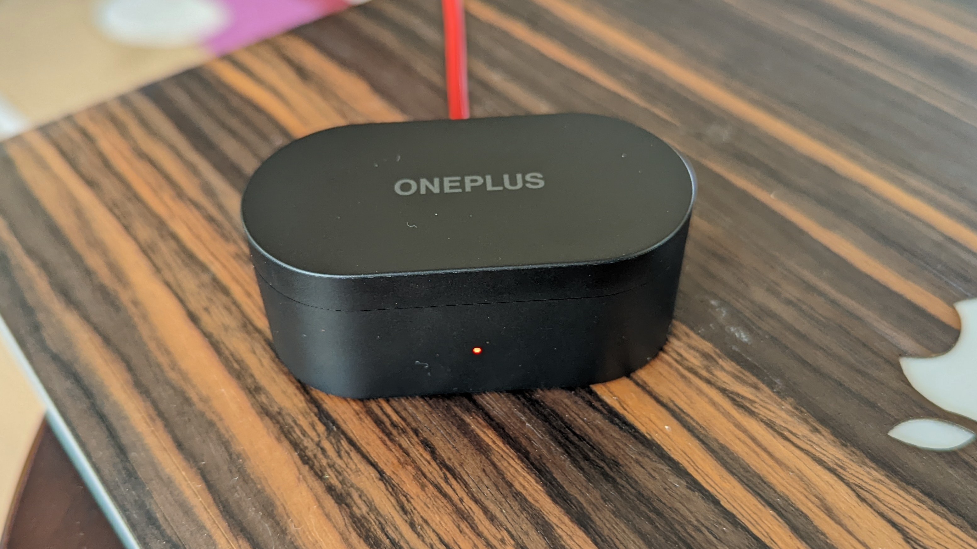 The OnePlus Nord Buds charging case being charged via USB-C cable