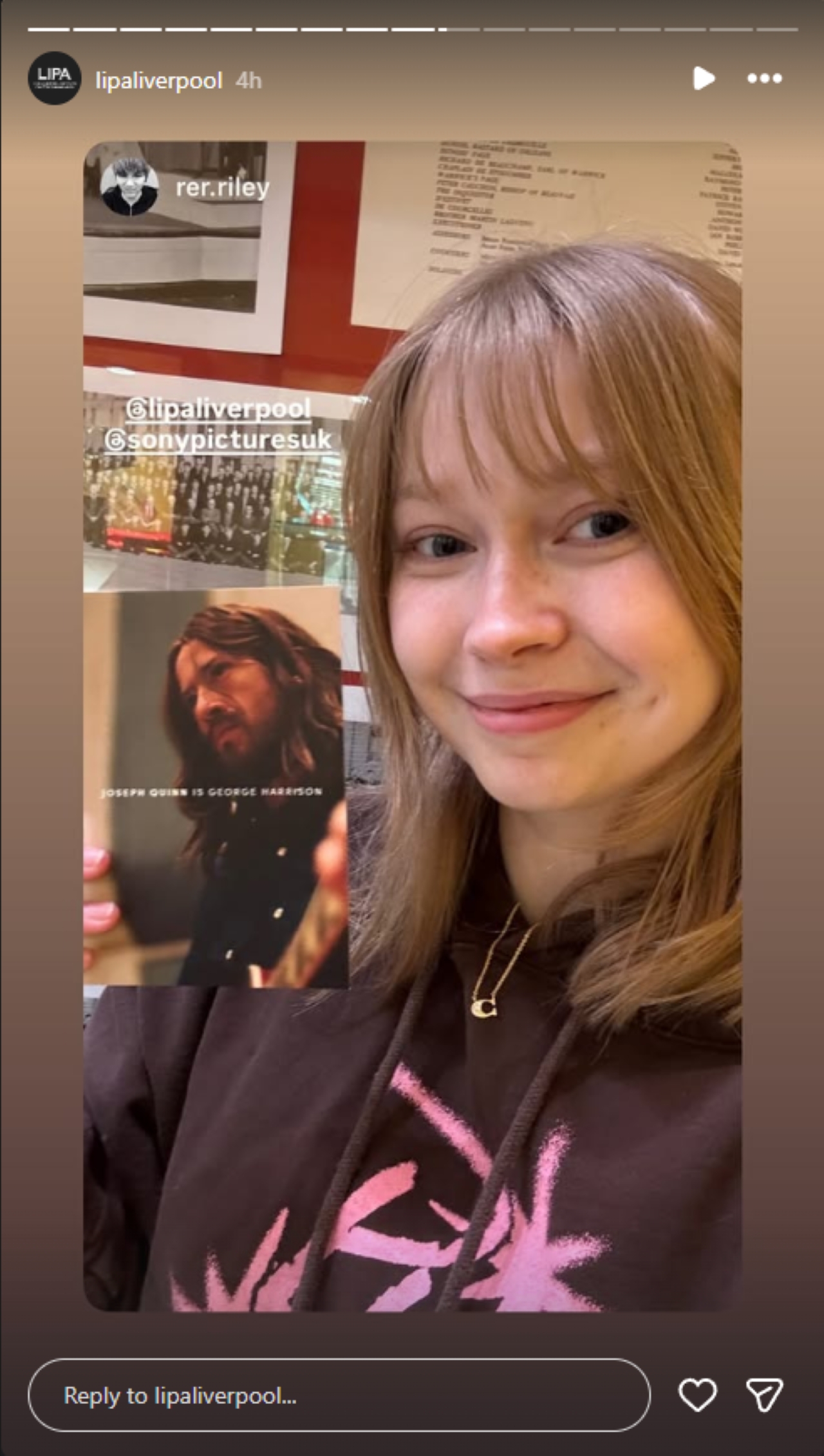 LIPA student holding postcard of Joseph Quinn as George Harrison