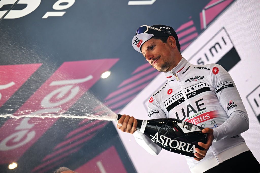 RIVOLI ITALY MAY 18 Joao Almeida of Portugal and UAE Team Emirates celebrates at podium as White best young jersey winner during the 106th Giro dItalia 2023 Stage 12 a 185km stage from Bra to Rivoli UCIWT on May 18 2023 in Rivoli Italy Photo by Stuart FranklinGetty Images