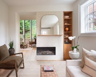 Corner fireplace on white brick feature hearth