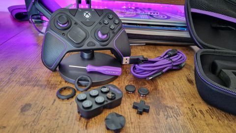 Victrix Pro BFG for Xbox on a wooden desk in front of purple lighting