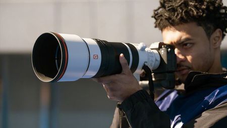 Sony FE 100-400mm f/4.5 GM OSS being used by a photographer outdoors