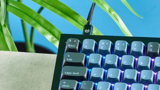 A black and blue Keychron Q7 wired mechanical keyboard that's made of metal