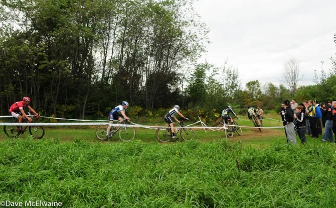 The leaders round a turn at the top of the course