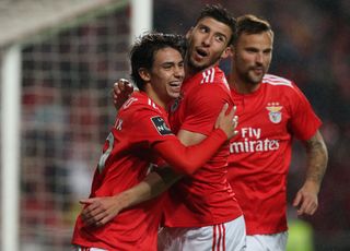 Benfica players celebrate a goal against Nacional in February 2019.