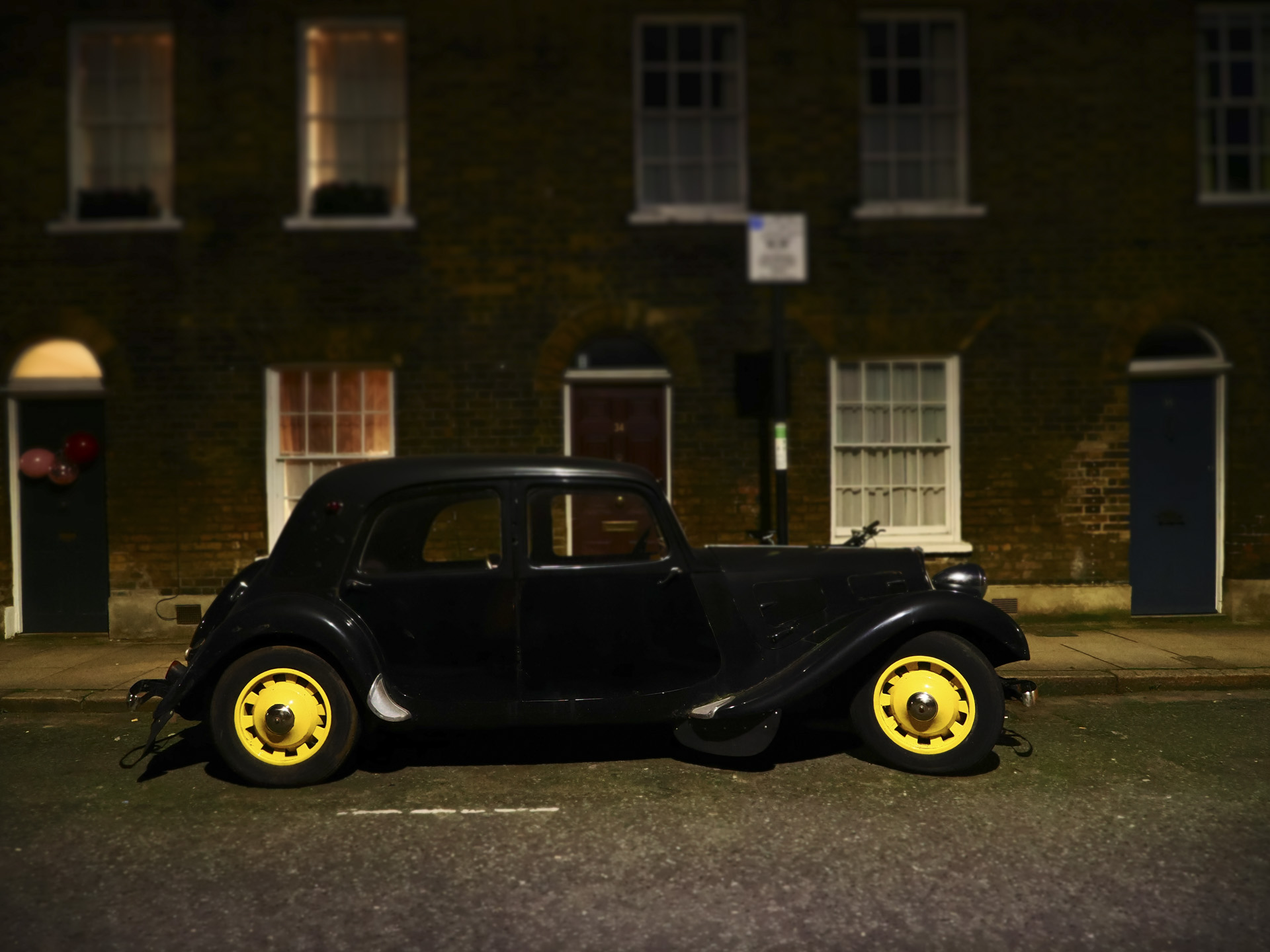 OM System OM-3 sample photos: classic car in quaint London street at night