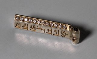Gold Bar Pendant an 18 carat yellow gold ingot carved with ancient Sanskrit
