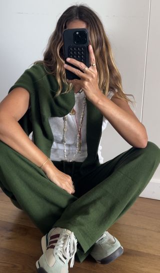 Angie wears a green cashmere co-ord set