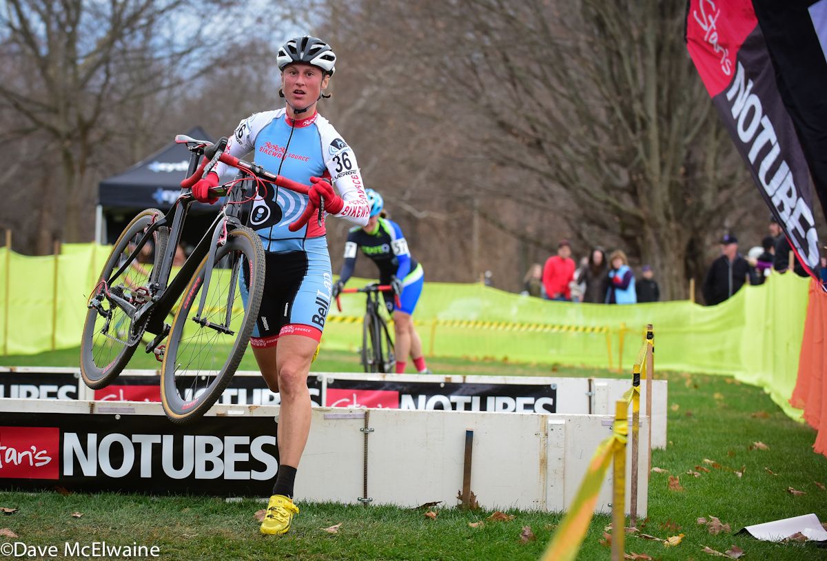Rebecca Wellons (Bikeway Source) running the barriers on lap four