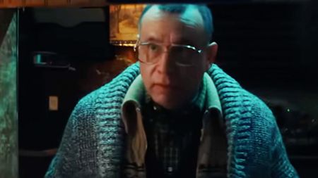 Fred Armisen wearing glasses and a sweater and looking creepy in Nimrods