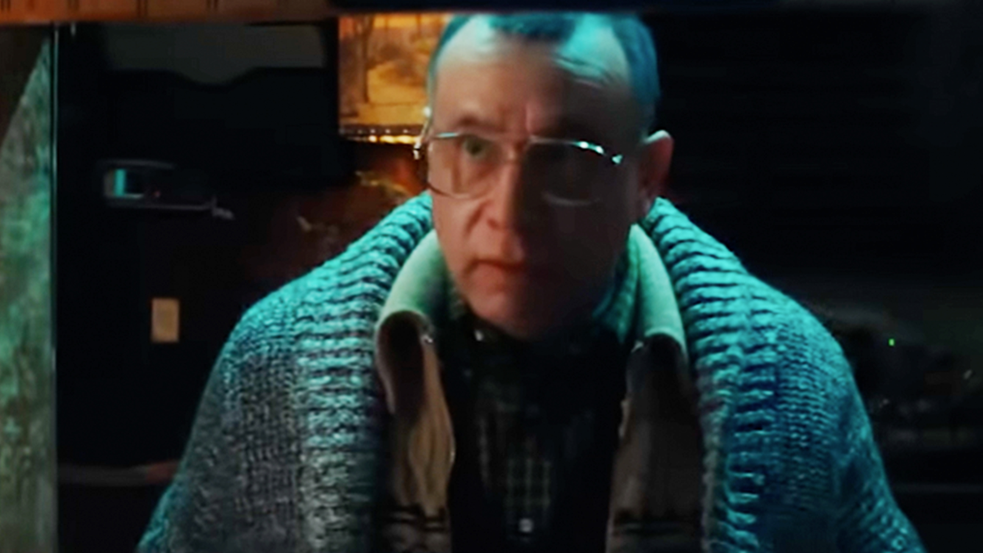 Fred Armisen wearing glasses and a sweater and looking creepy in Nimrods