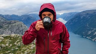 rain jacket for hiking: Revolution Race Cyclone Rescue 2.0 and mug