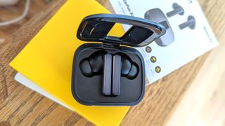 The EarFun Air Pro SV wireless earbuds docked in the charging case