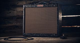 Fender Blues Junior IV 30th Anniversary: the classic combo is refinished with a touch of cowboy western flair, and is here photographed against some weathered floorboards in close-up