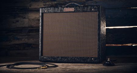 Fender Blues Junior IV 30th Anniversary: the classic combo is refinished with a touch of cowboy western flair, and is here photographed against some weathered floorboards in close-up