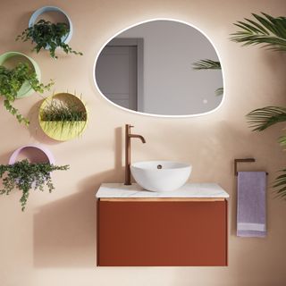basin with mirror above in bathroom
