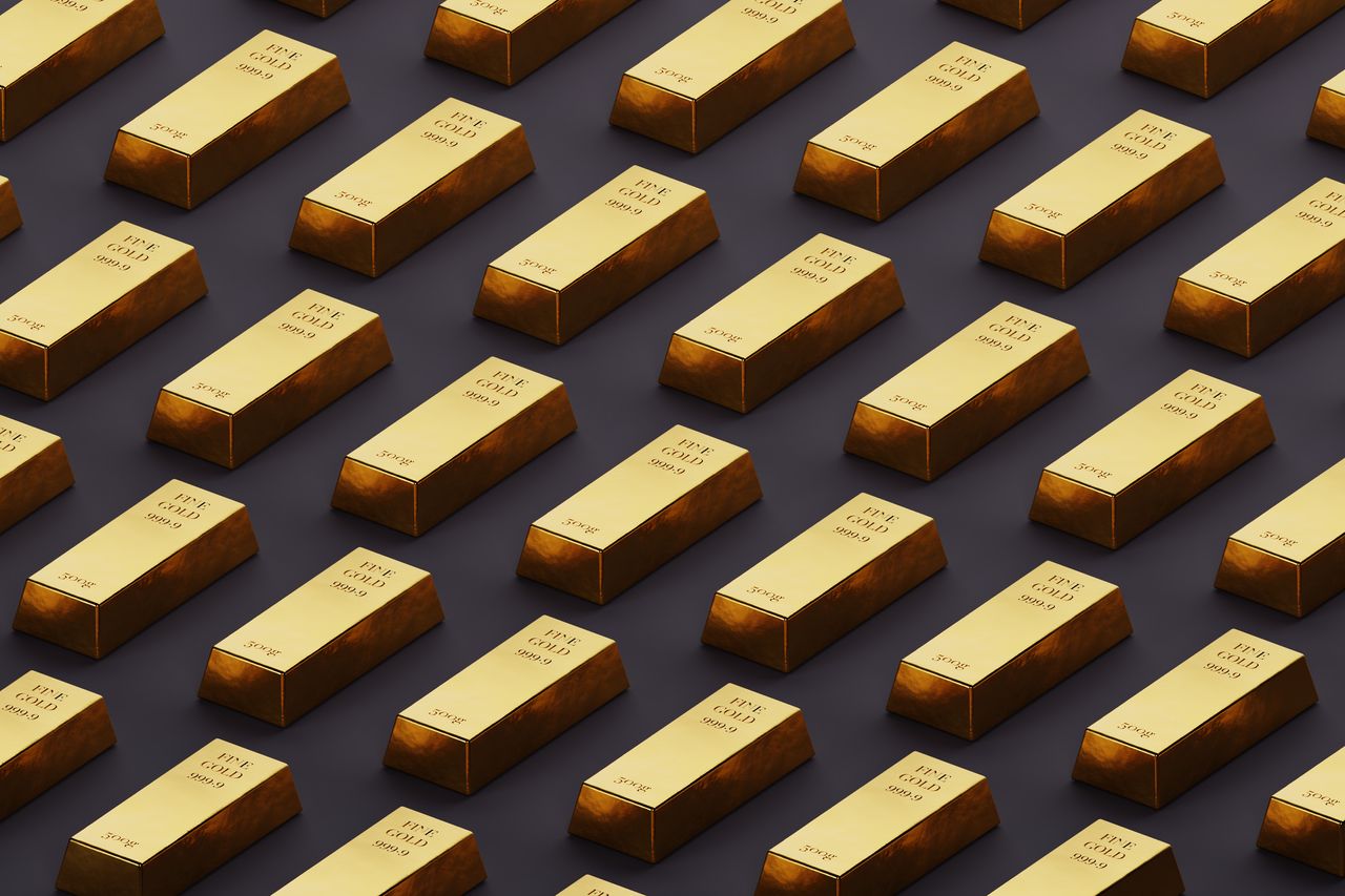 Gold bars arranged against a black backdrop