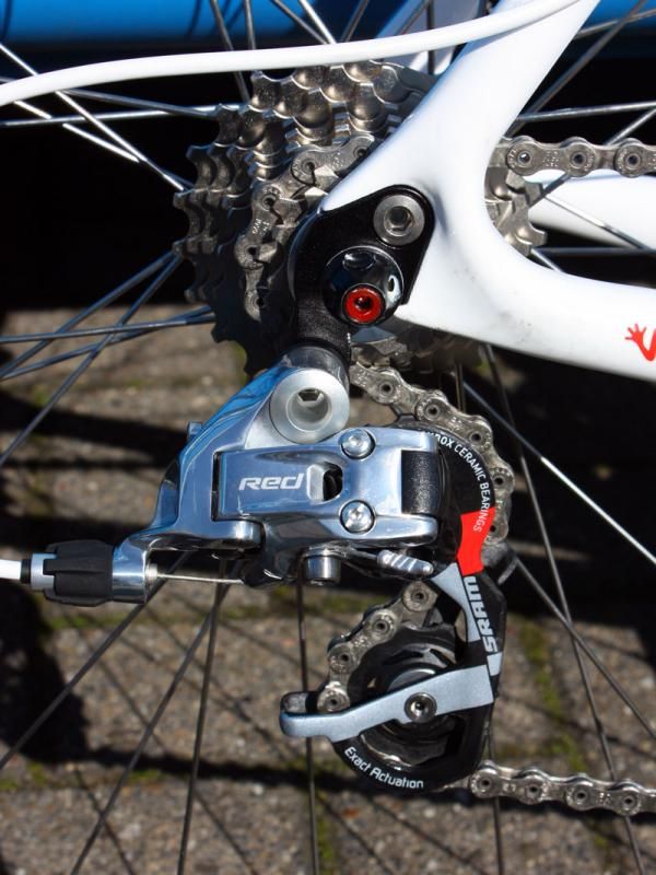 A SRAM Red rear derailleur is bolted to a replaceable hanger.