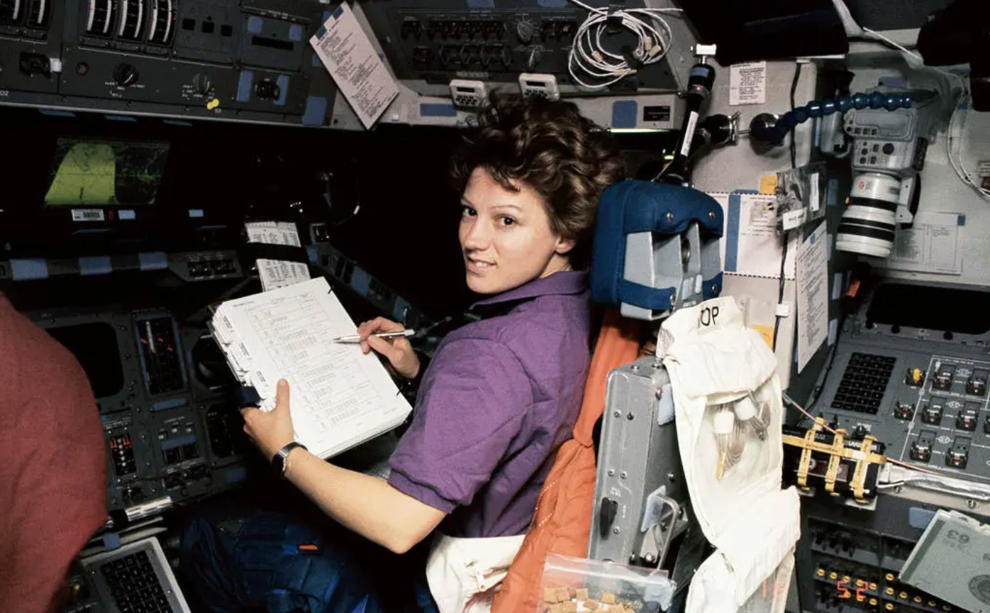 a female space shuttle pilot who works in space