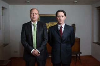 Inside No 9 stars Steve Pemberton and Reece Shearsmith wearing suits and ties, looking serious