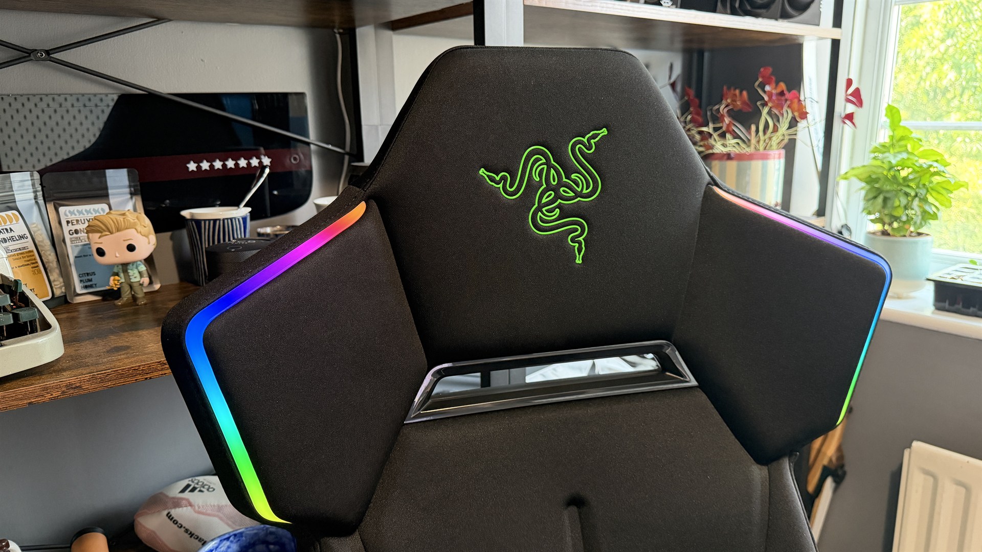 The Razer Soma Chroma gaming chair set up in front of a desk.