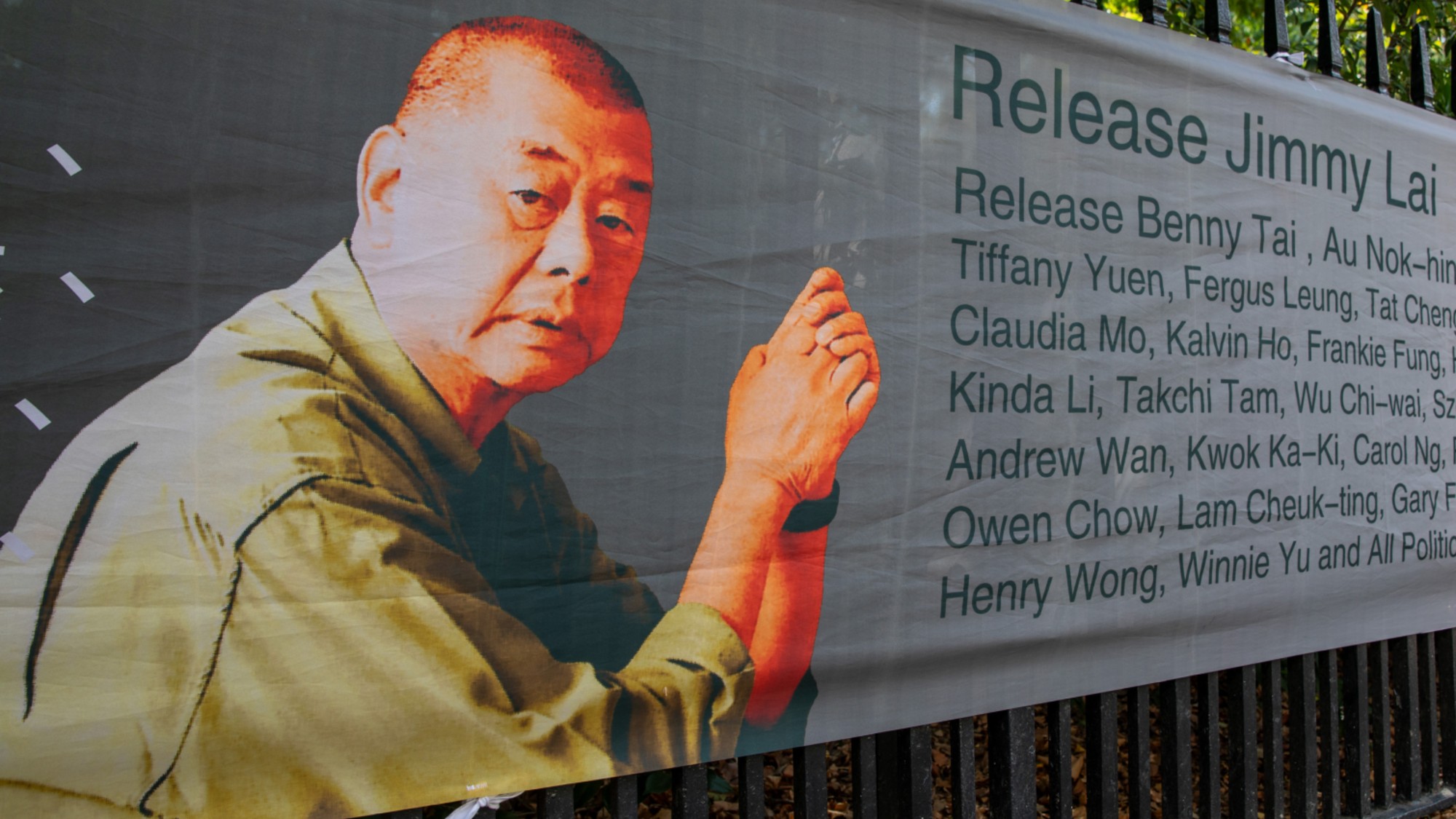 Poster of Jimmy Lai with the words "release jimmy lai" and multiple signatories