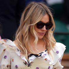 Sienna Miller attended Wimbledon 2025 in a floral little white dress from Alessandra Rich